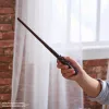 Wizarding World Harry Potter, 12-Zoll magischer Sammler-Harry-Potter-Zauberstab mit Ständer & Druckguss-Ikone, Magische Geschöpfe, Accessoire für Kostüme